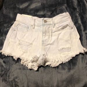 Bullhead Light wash distressed denim jean shorts.